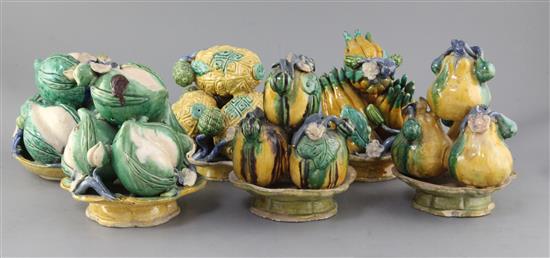 Six Chinese Canton pottery models of stacking fruit in dishes, late 19th century, height 16cm - 18.5cm
